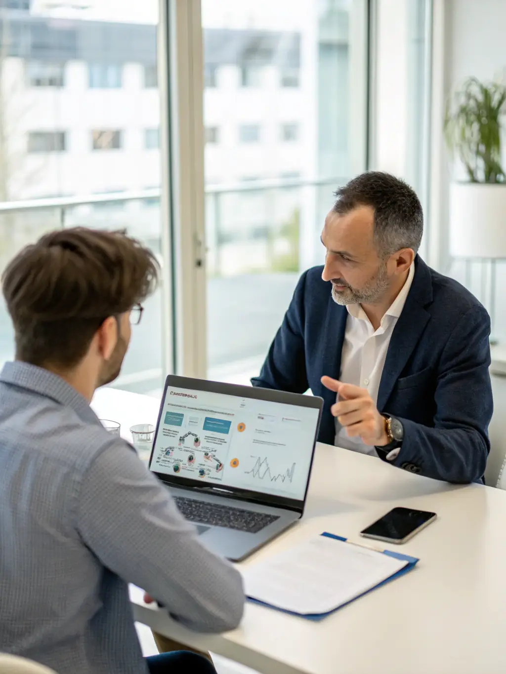 A consultant discussing IT strategies with a client in a modern office setting, emphasizing collaboration and problem-solving.